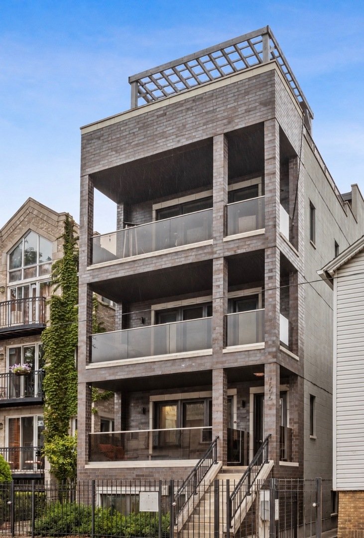Front exterior of 1506 W Superior St, Chicago, a modern gray brick building in Noble Square