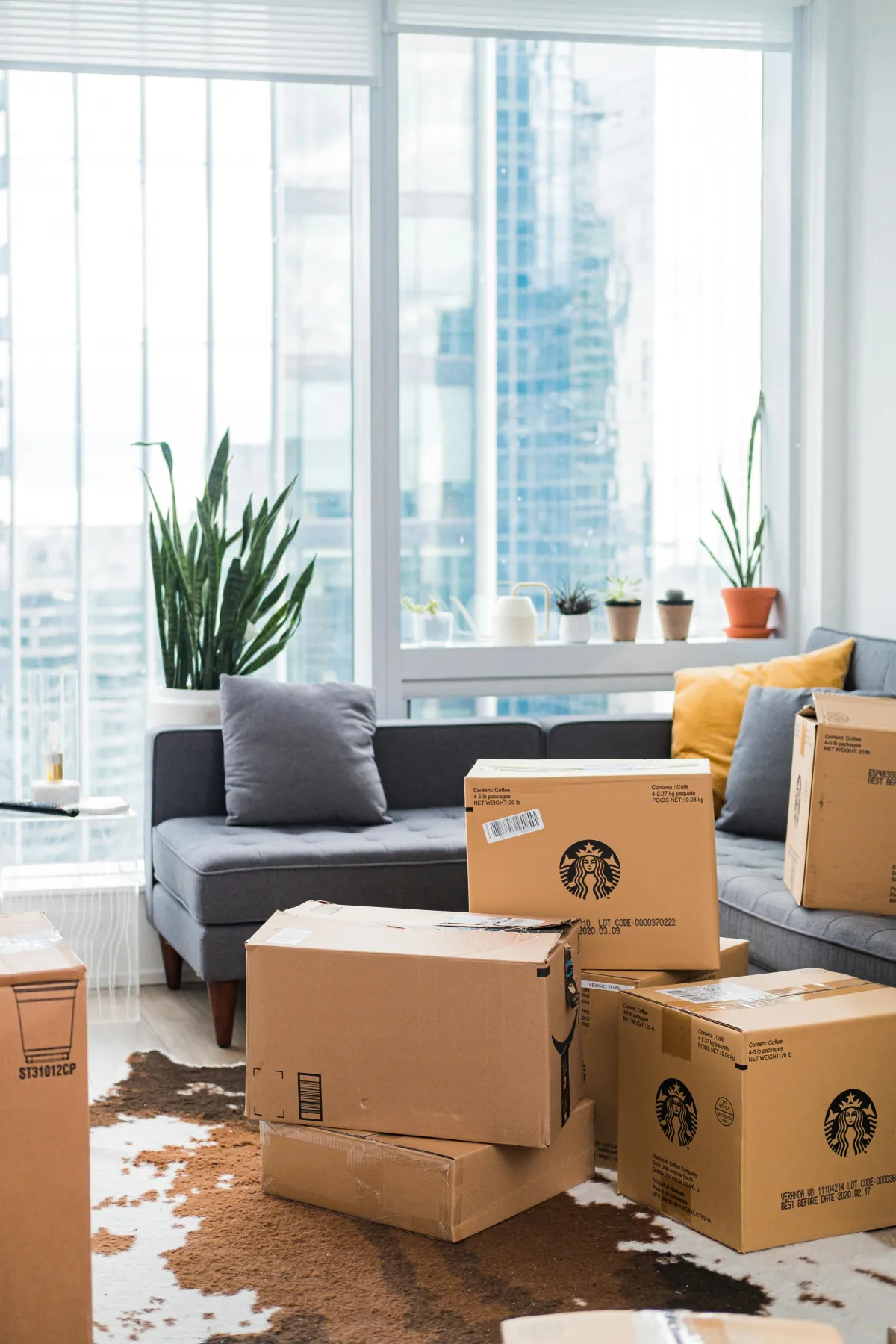 Moving boxes stacked in the living room of a Chicago apartment as tenants consider their future